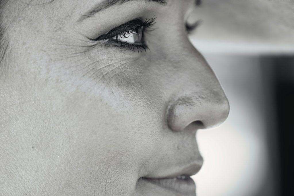 womans face in close up photography