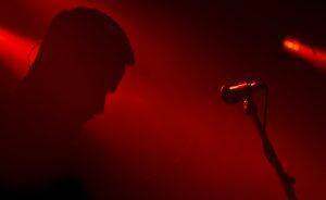 a person standing in front of a microphone