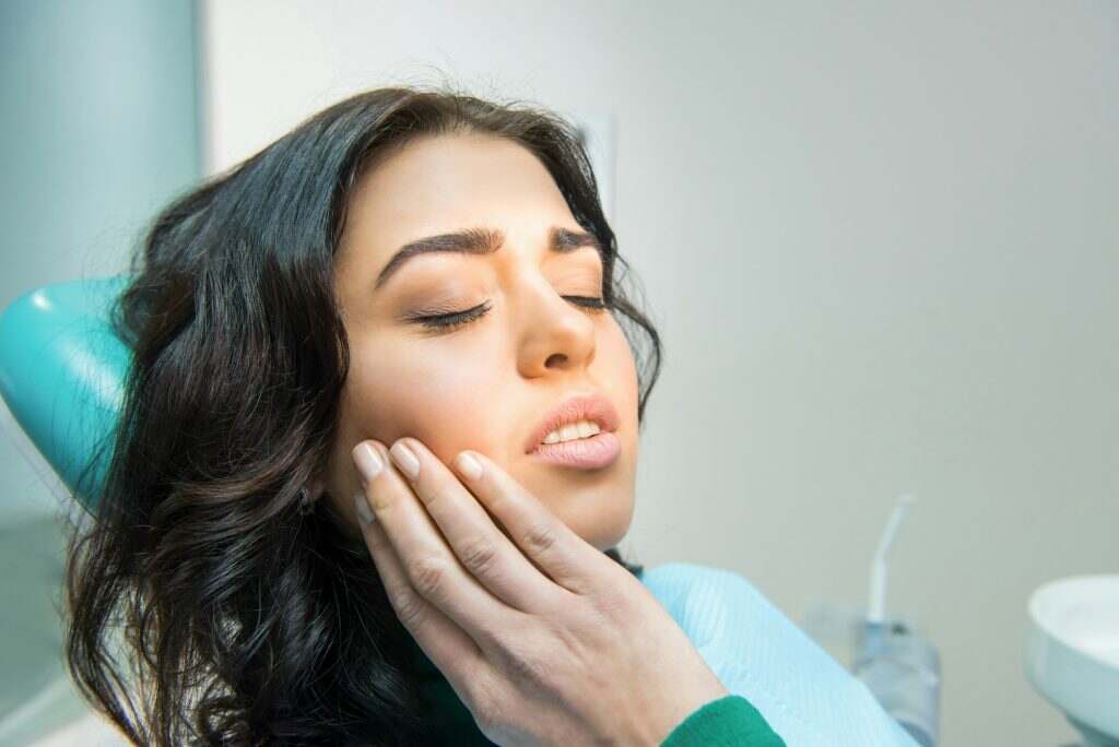 Young woman having toothache