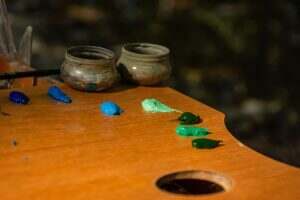 Oil paints on the palette. Plein air on the street.