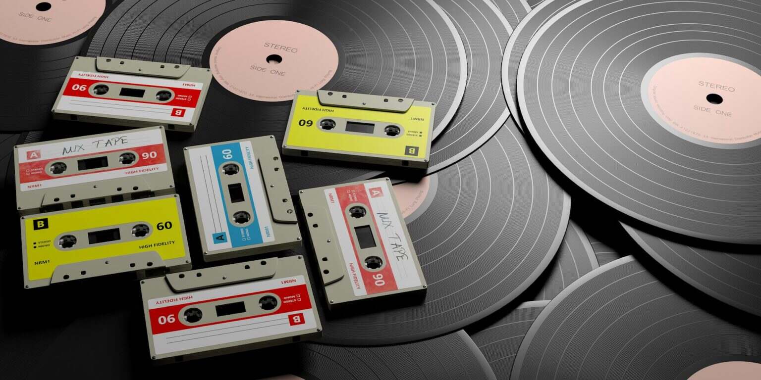 Vintage audio cassettes on wooden background, mix tape label, 3d illustration