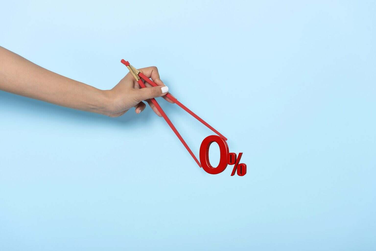 Woman hand holding chopsticks showing 0% number or zero percent isolated on blue banner background.
