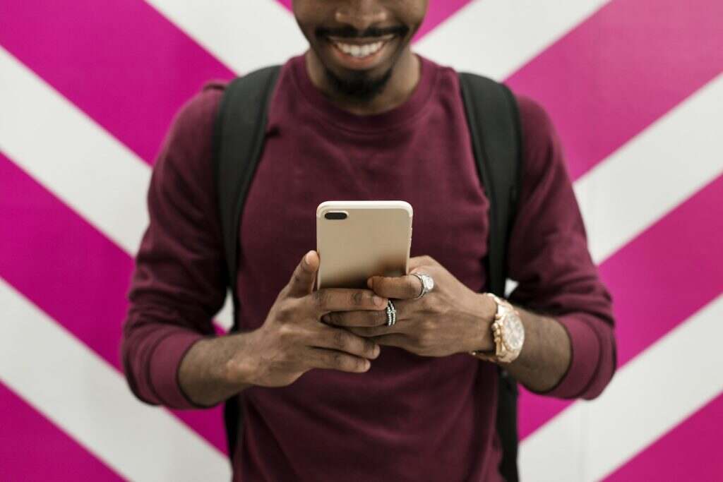 African man using mobile phone
