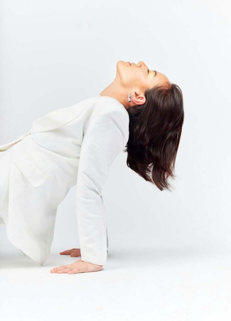 Fashion, magazine cover and a model woman in studio on a white background for trendy or classy styl