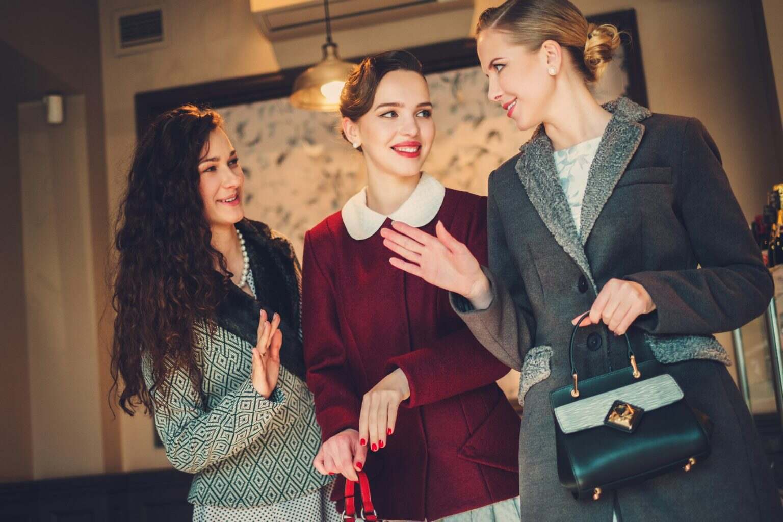 Three elegant young ladies ready for a party