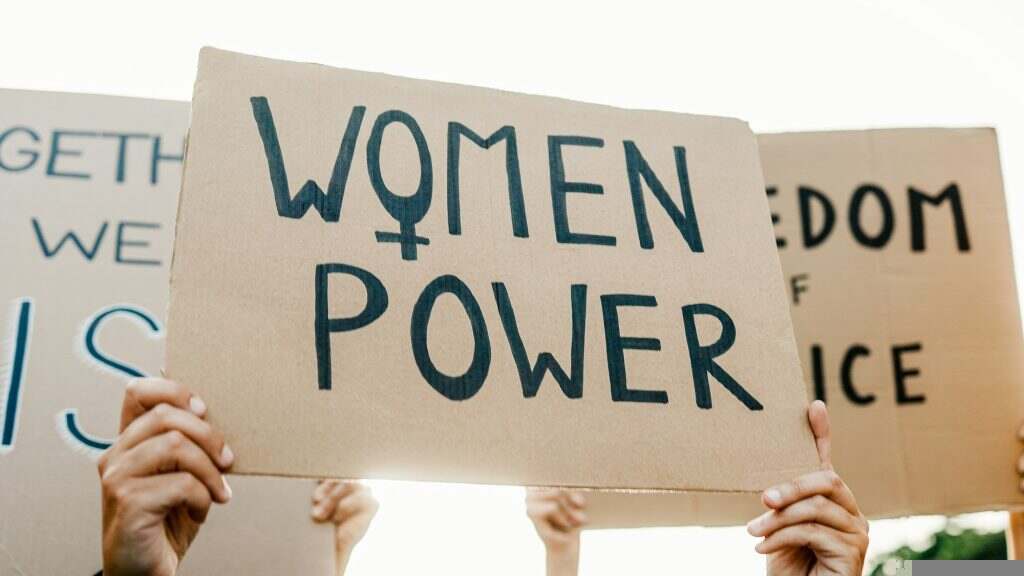 Group of women protest for female rights at demonstration. Feminist empowerment and equality