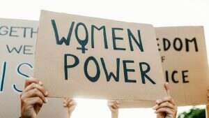 Group of women protest for female rights at demonstration. Feminist empowerment and equality