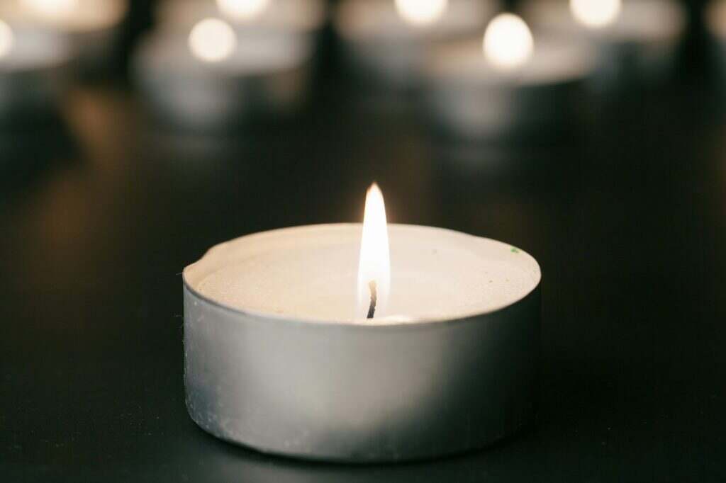 Candles Burning at Night. White Candles Burning in the Dark