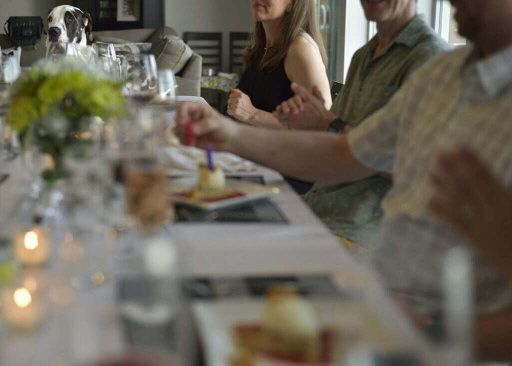 Family and friends holiday meal table.