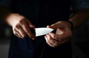 Man Holds Sharp Kitchen Knife