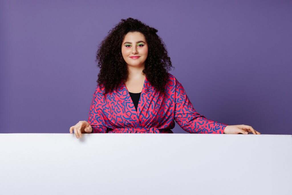 Plus size woman in bright suit