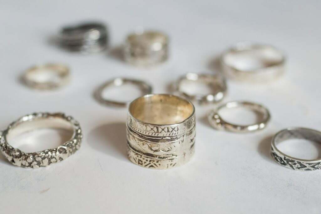 Silver jewelry on a soft white background. Handcraft elegant silver rings.