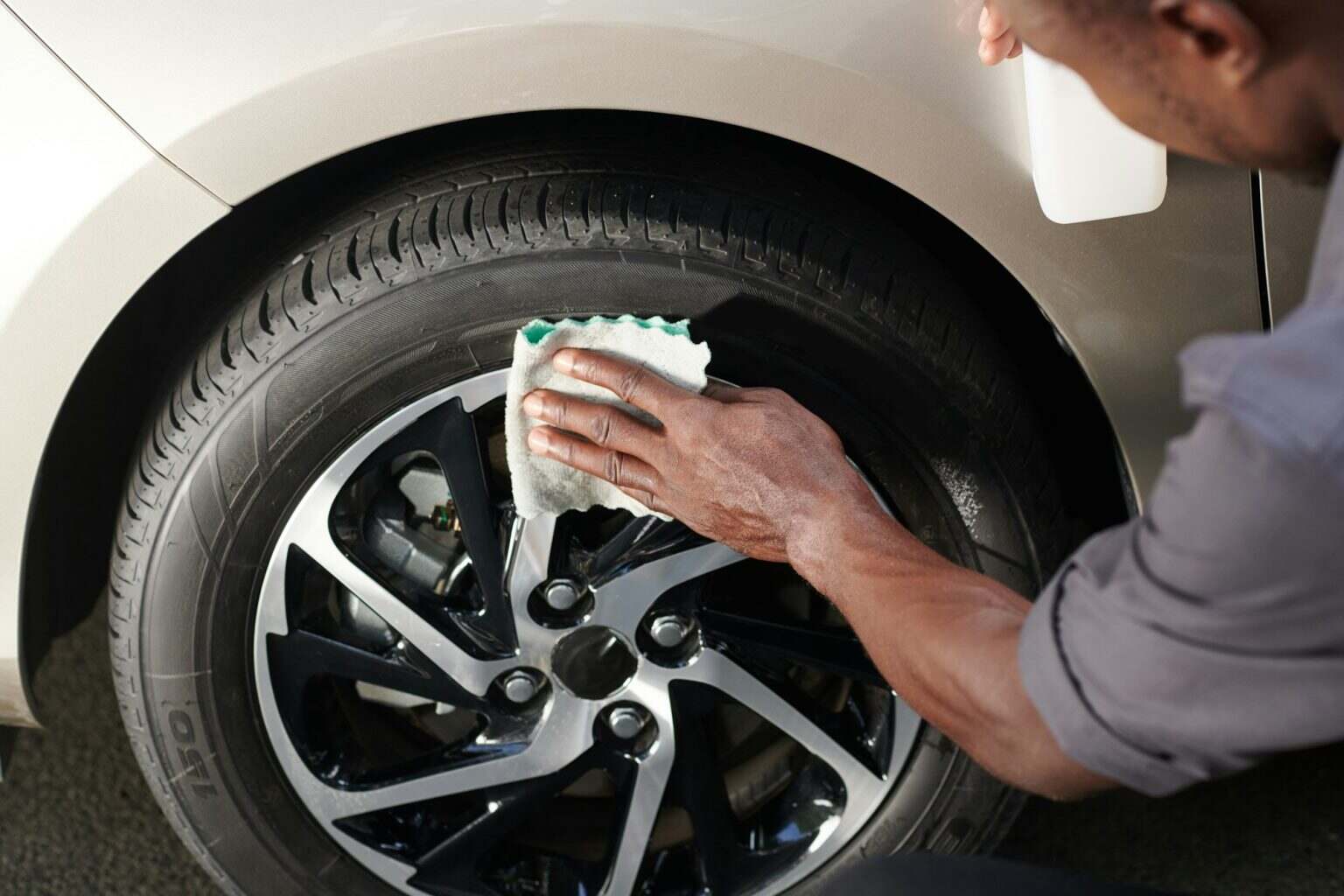 Driver Cleaning Aluminum Wheels