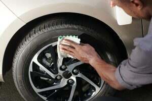 Driver Cleaning Aluminum Wheels