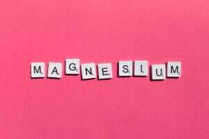 Magnesium scrabble letters word on a pink background
