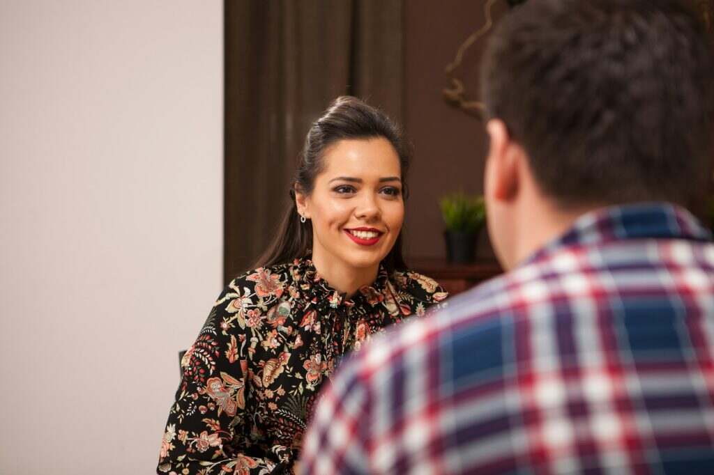 Young couple talking about the future in a cozy vintage pub.