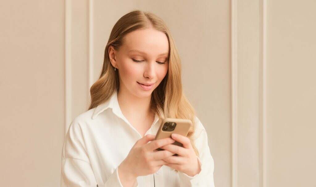 Young woman using dating app on phone, swiping and touching screen. Using smart phone