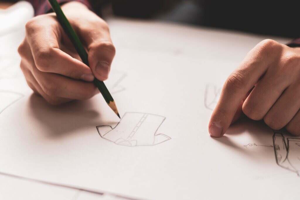fashion designer draw clothes concept with pencil b