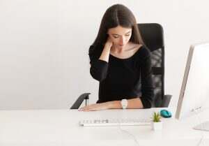 Pain neck. Tired business woman holding her neck