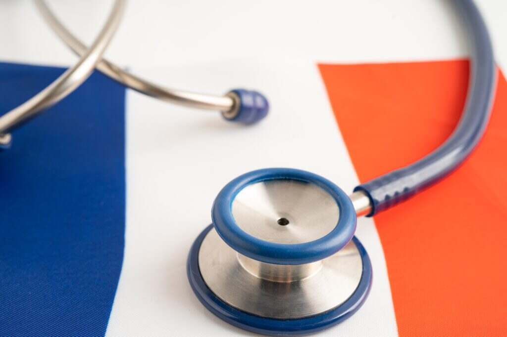 Stethoscope on France flag background, Business and finance concept.