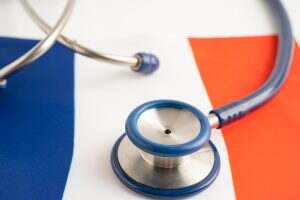 Stethoscope on France flag background, Business and finance concept.