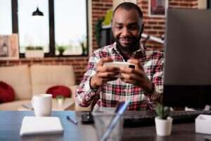 Young adult playing video games