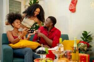 A family enjoying a cozy Christmas evening at home