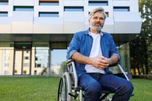 Accessible Healthcare: A Man in Wheelchair by the Clinic