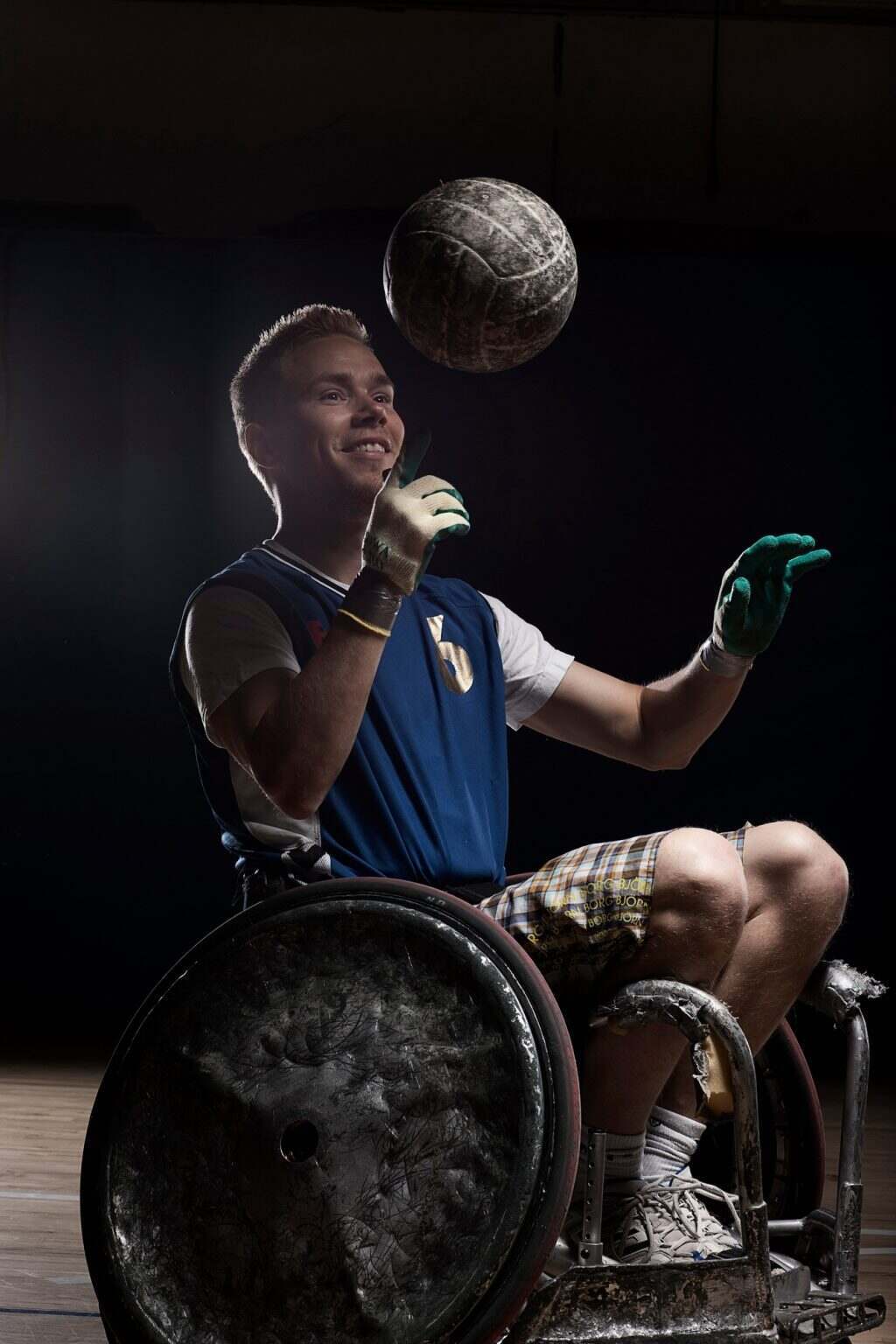Rugby player in wheelchair with ball