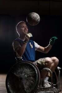 Rugby player in wheelchair with ball