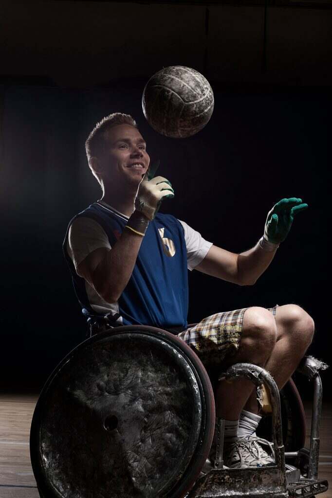 Rugby player in wheelchair with ball
