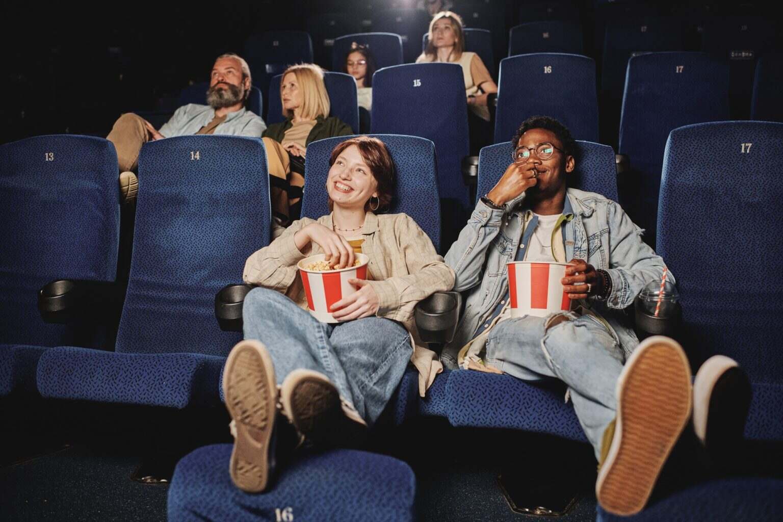 People Relaxing At Cinema