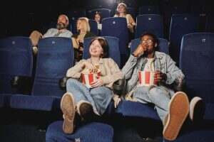 People Relaxing At Cinema