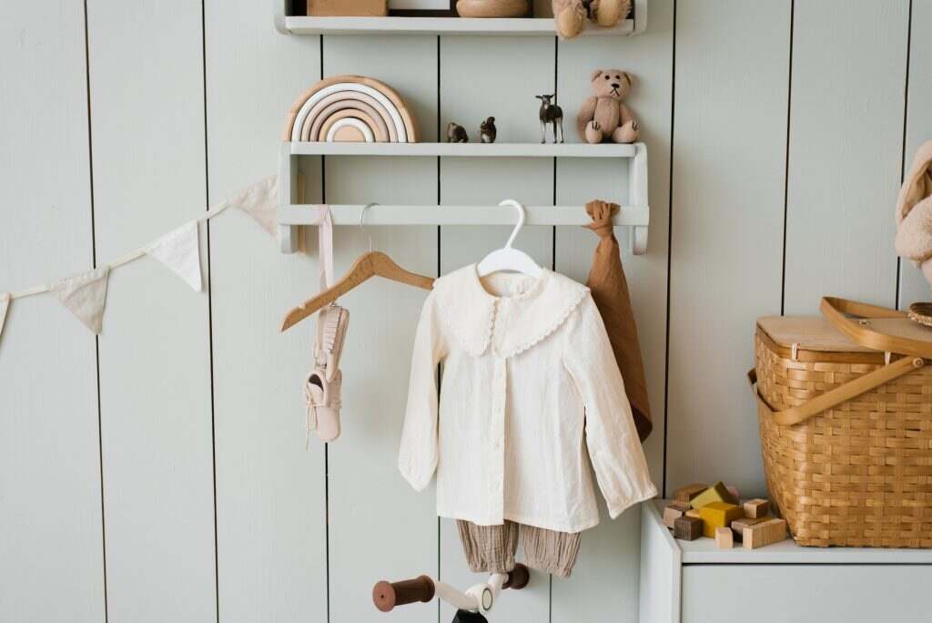 Toys and Children's Clothes in the Children's Room in Cozy Scandinavian Style