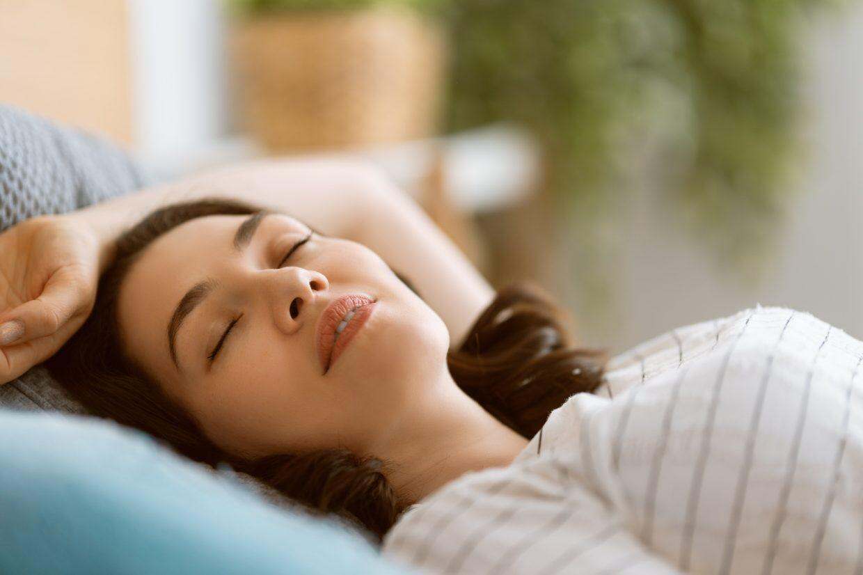 woman is sleeping in the bedroom