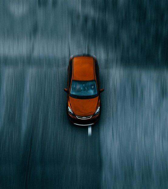 orange and black car on water