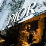 a reflection of a building in the windows of another building