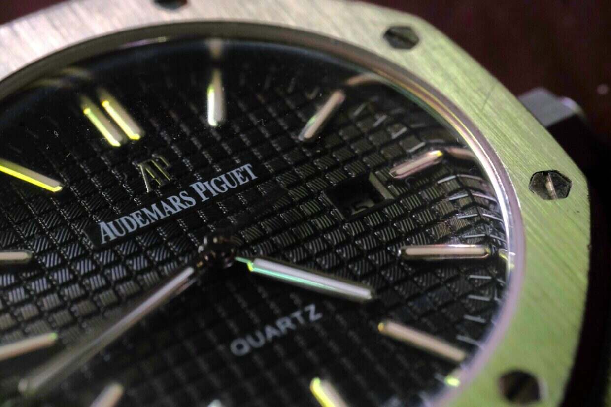 a close up of a watch on a table