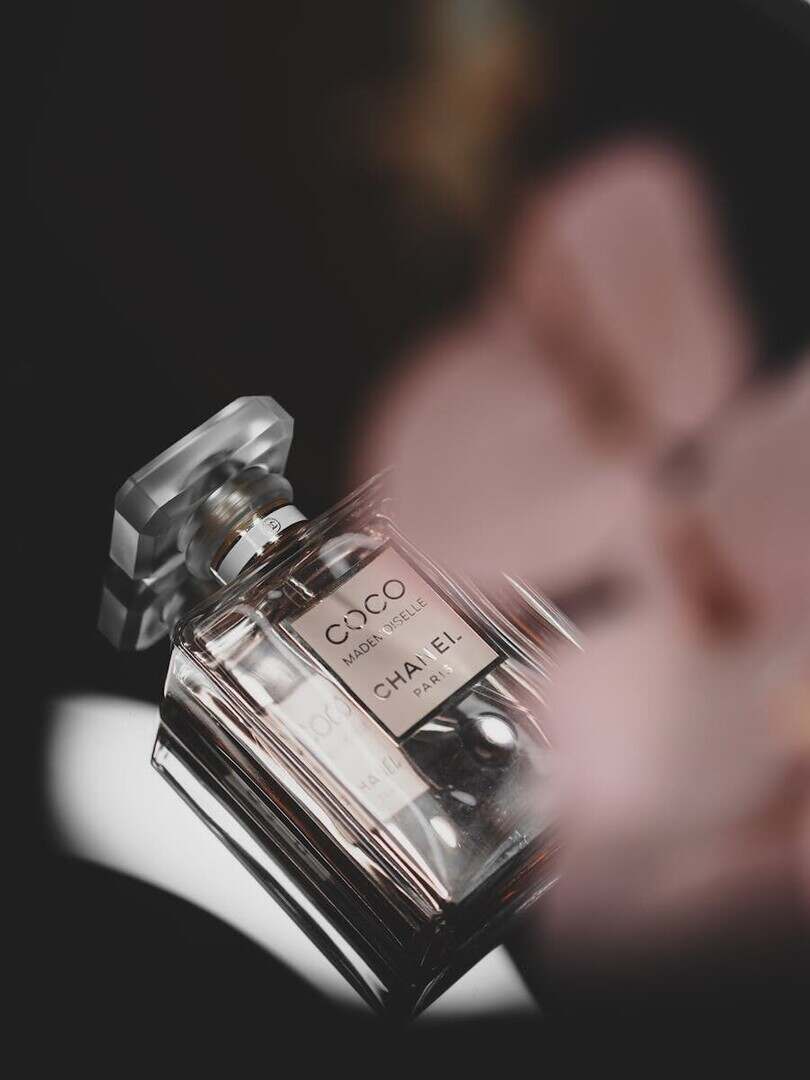 Elegant Chanel Coco perfume bottle captured on a minimalist black background.