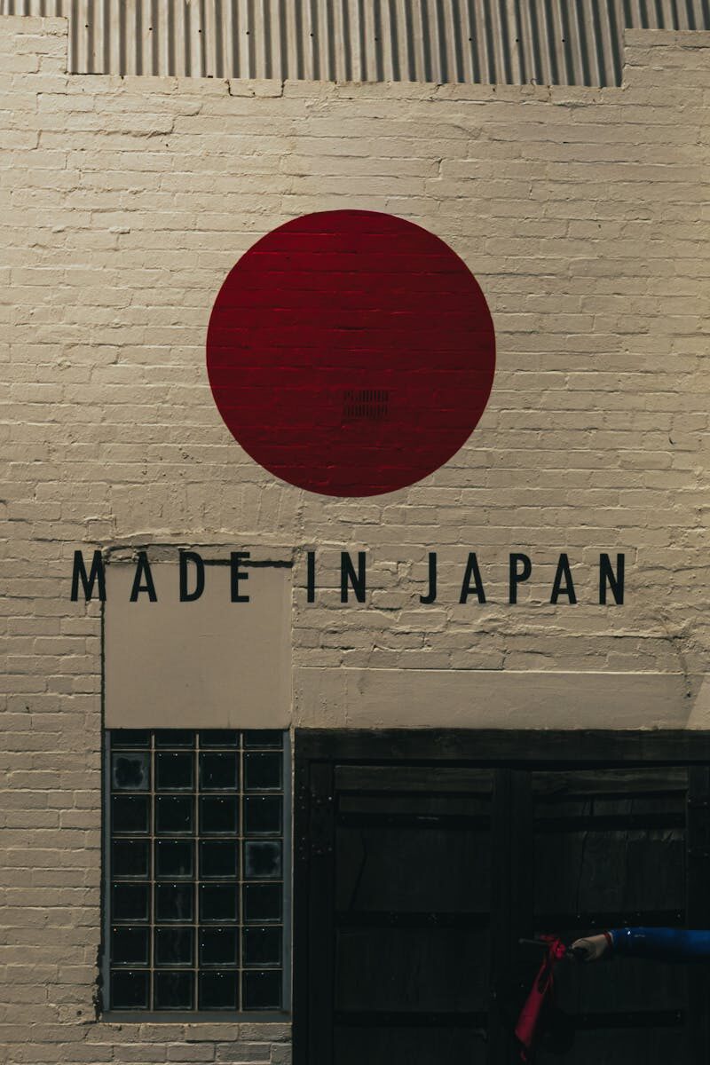 Artistic 'Made in Japan' wall with red circle resembling flag.
