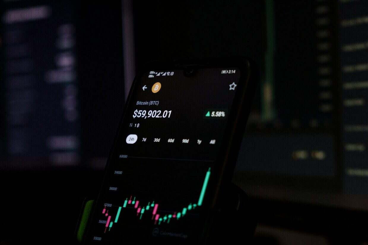 a cell phone displaying a stock chart on the screen