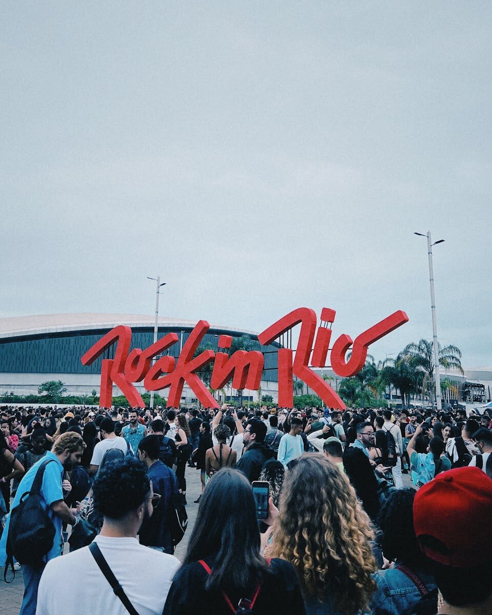 Large crowd at the iconic Rock in Rio festival with vibrant atmosphere and music celebration.