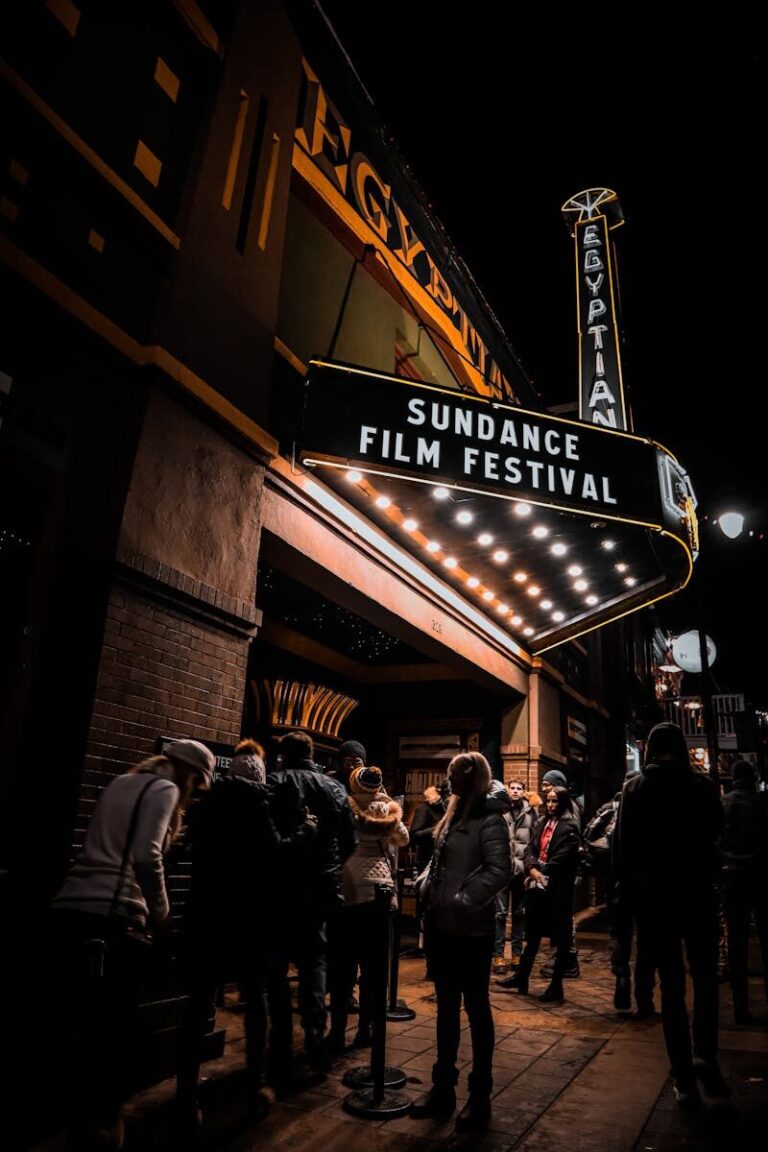 Crowd gathers under the illuminated marquee of the Egyptian Theatre during Sundance Film Festival in Park City.