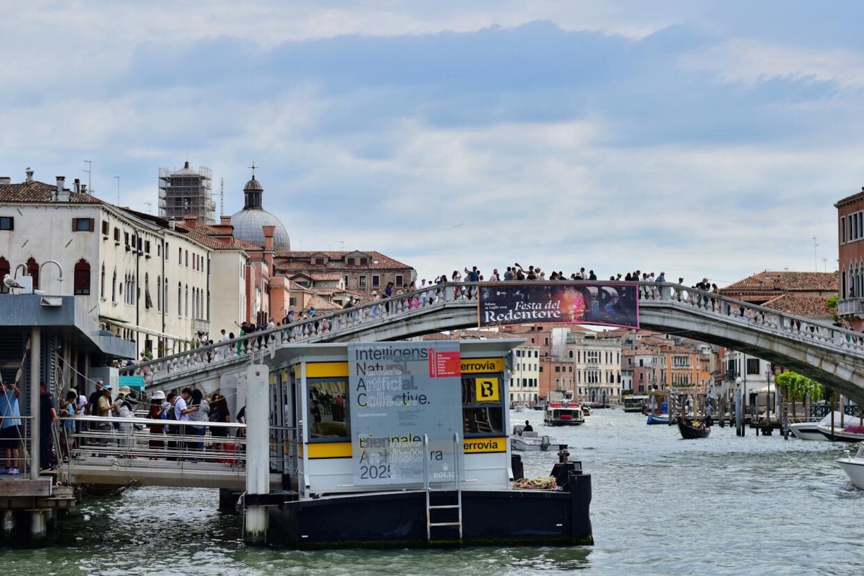 A vibrant crowd enjoys the Festa del Redentore on Ponte dell'Accademia in Venice, Italy.