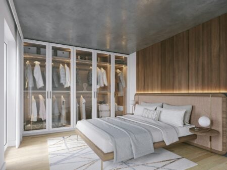 Pourquoi votre armoire déborde encore (et ce que le dressing change vraiment) a bedroom with a bed and a closet