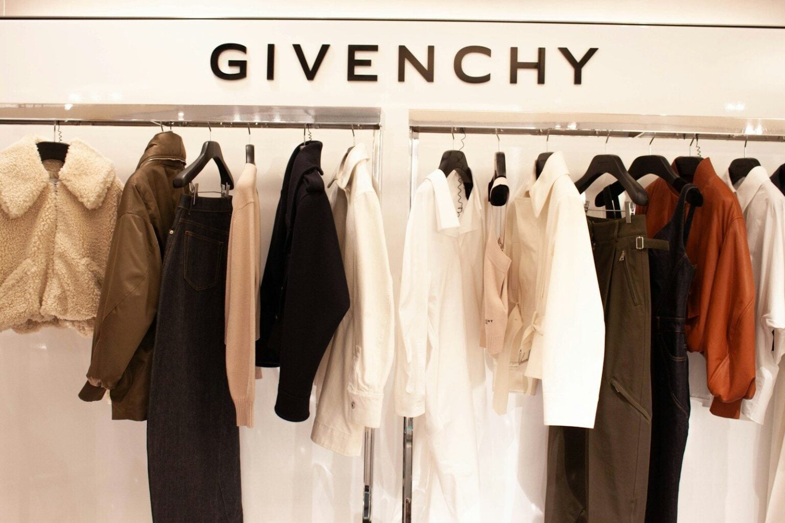 Givenchy logo above a rack of women's clothing