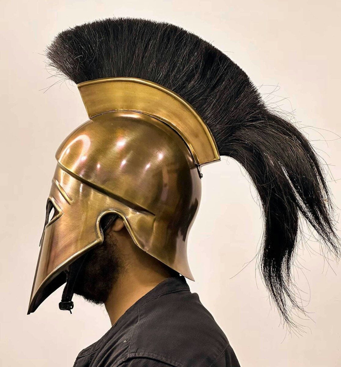a man wearing a helmet with a long black hair